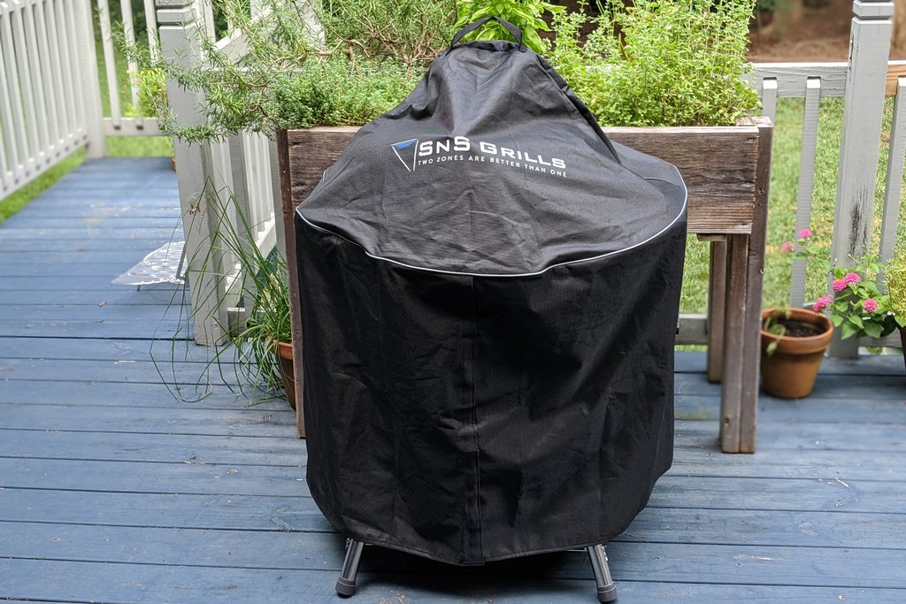This image show a SNS Kettle grill Covered with the BBQ Cover